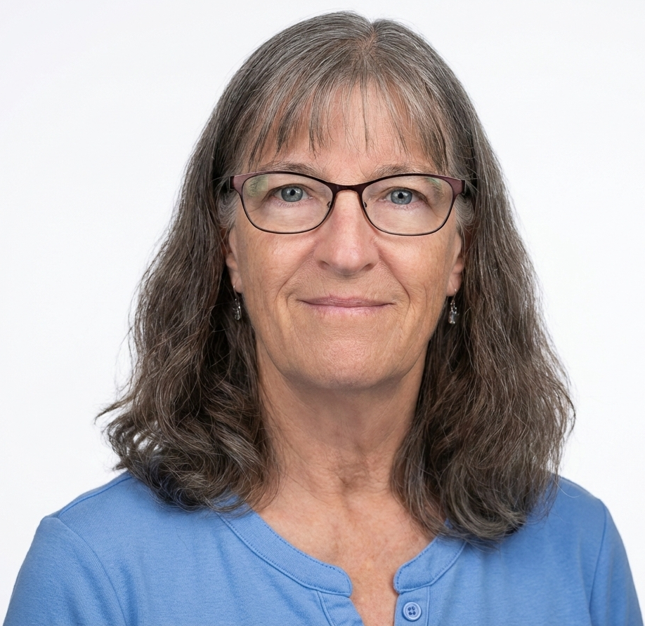 a lady with glasses and blue shirt